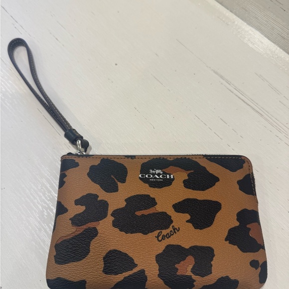 Coach Handbags - Coach Tan and Black Animal Print Wristlet